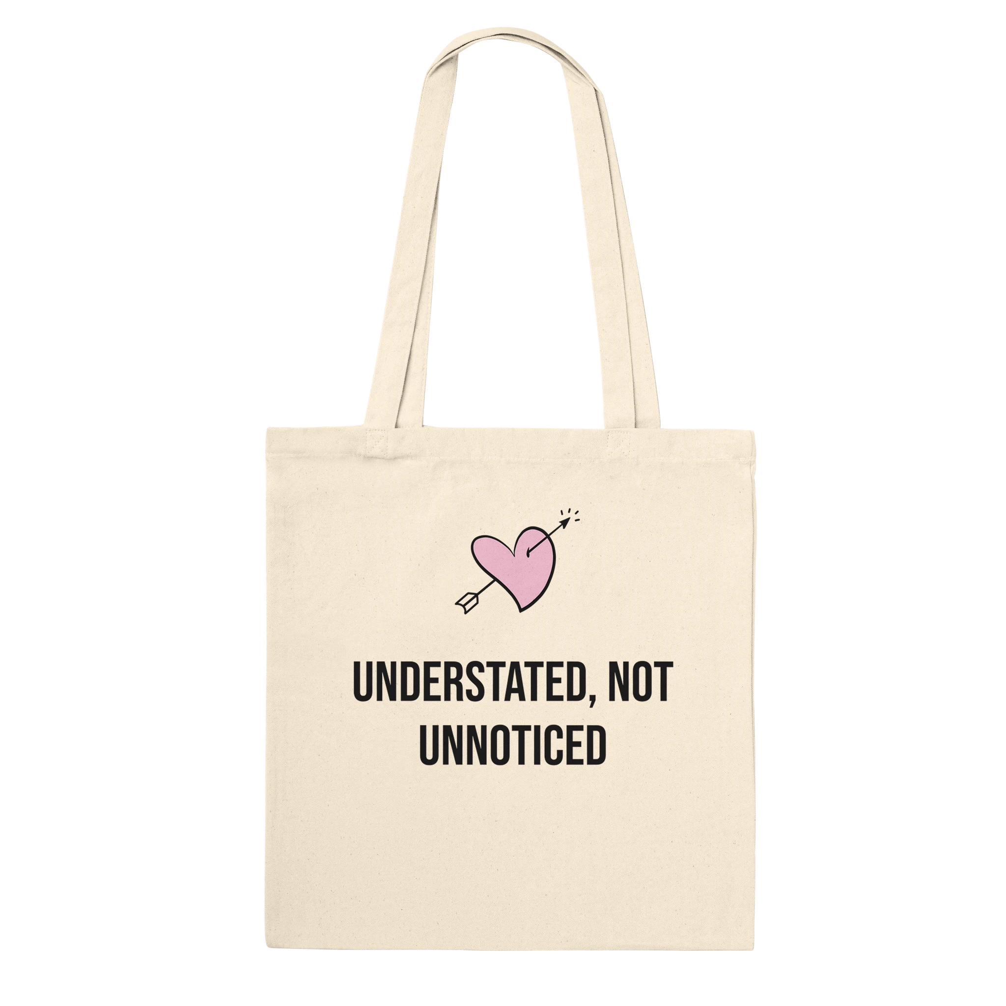 Reinforced cotton tote bag with the phrase 'Understated, Not Unnoticed'